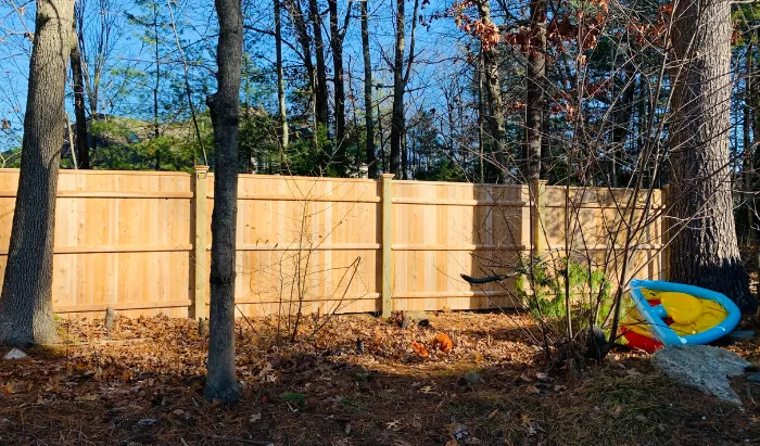 New England Pro Fence team working on a fence installation project in Massachusetts