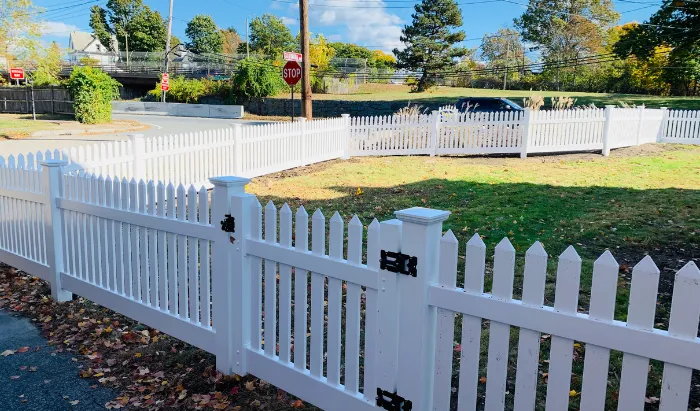 Professional fence installation completed in a backyard in Lowell Massachusetts by New England Pro Fence