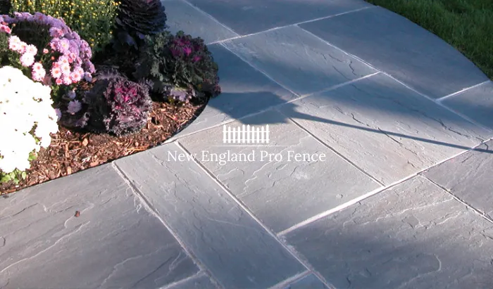 Premium natural bluestone in irregular or cut patterns. Cool gray-blue tones create an elegant, sophisticated entrance path that is immediately striking. Extremely popular in Massachusetts for front door walkways. Bluestone is exceptionally hard, slip-resistant when textured, and looks stunning in all seasons.