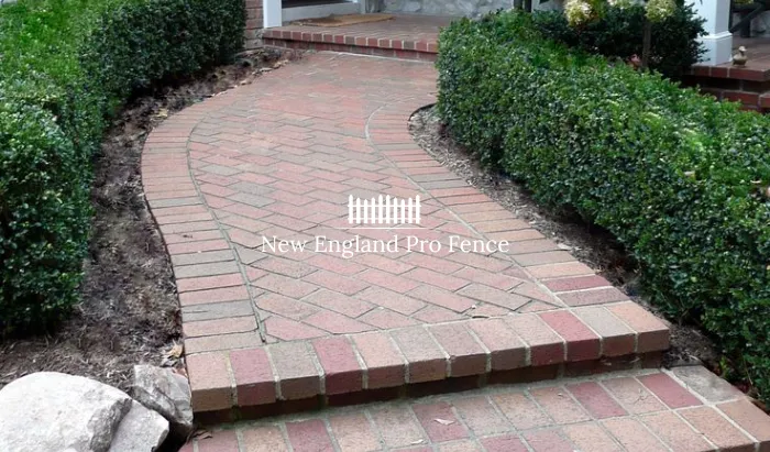 Classic New England style. Clay brick pavers in herringbone or running bond patterns bring warm, natural tones that complement any home style — from colonial to craftsman. The most popular choice for front door walkways across Massachusetts. Slip-resistant surface and eco-friendly production. Color never fades.