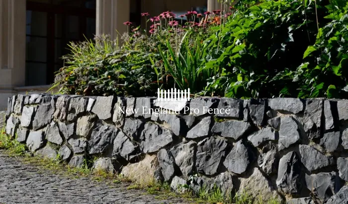 Engineered retaining walls that hold back soil, prevent erosion, and create level terraces on sloped properties. Natural stone, granite block, and segmental retaining wall options. Proper drainage and structural reinforcement included. Essential for sloped Massachusetts properties where erosion and grade changes threaten landscapes, driveways, and foundations.